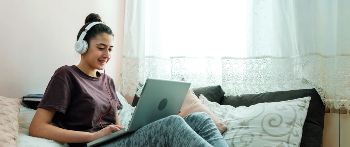 Teenage girl studying at home during COVID-19 pandemic