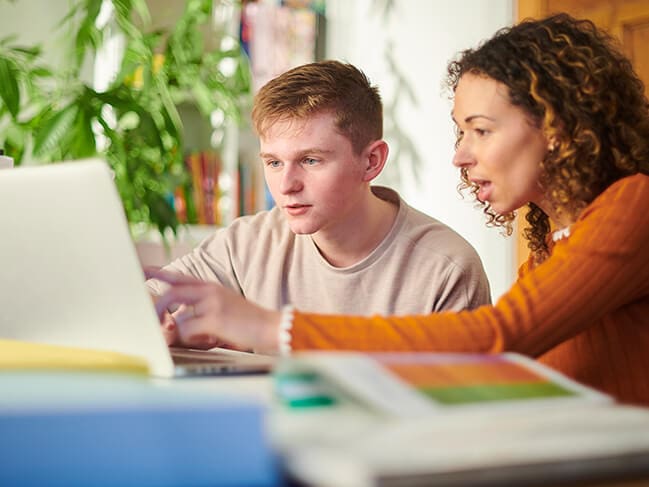 Student and parent learning virtually