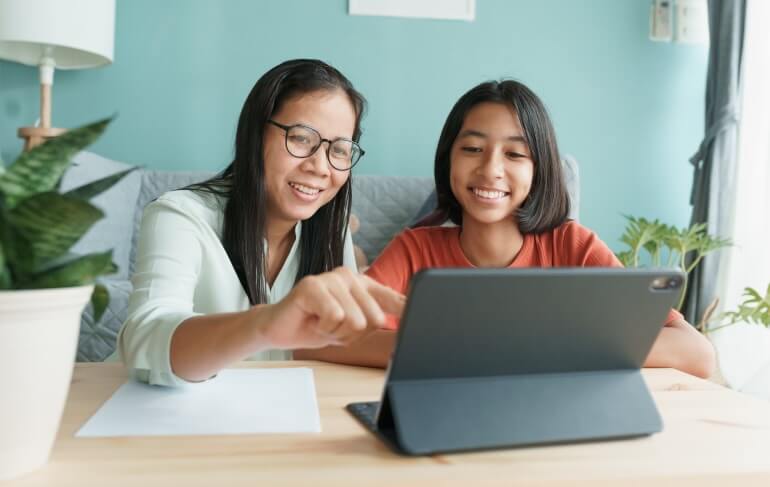 Middle school student learning on tablet