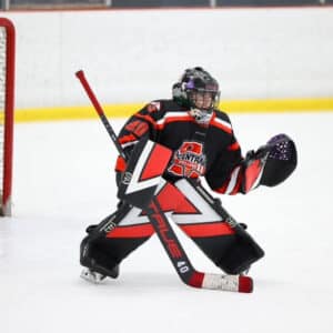 Sami Evans playing hockey