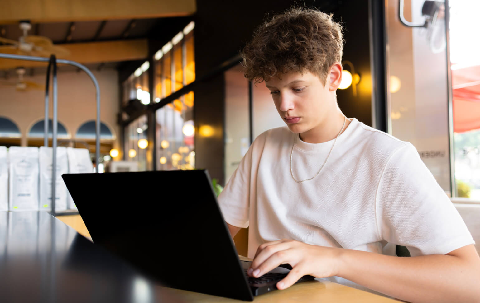 Student learning in a hotel lobby